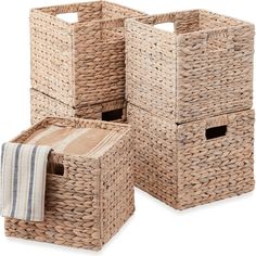 three wicker baskets with towels in them on a white background, one is empty and the other has a striped towel