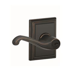 an image of a door handle on a black door knob with a satin bronze finish