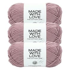 three balls of yarn with the words made with love