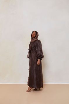 The Organza Abaya is statement outfit for any event. It's super lightweight yet so simple with the prettiest sheen. Complete the look with our matching long sleeve satin slip dress and a pair of strappy heels for a luxe finish or make it into a more casual look. Model is wearing a size Small Model Measurements: Height 5'8. Waist 25", Bust 32", Hips 37" *Please note that the color displayed in the picture might be slightly different due to the color resolution and lighting. Fabric Description & C Elegant Silk Abaya With Long Sleeves, Elegant Long Sleeve Silk Abaya, Silk Long Sleeve Abaya For Party, Silk Long Sleeve Party Abaya, Formal Long Sleeve Silk Abaya, Silk Long Abaya For Eid, Long Silk Abaya For Eid, Elegant Silk Abaya For Eid, Elegant Silk Maxi Abaya