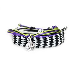 It's Showtime! Available individually or as a set. Black, White, Purple, & Lime Green. Hand made with high quality nylon knotting cord. Available in multiple sizes and adjustable knot closure for the perfect fit every time. See below for size chart. White Casual Nylon Cord Braided Bracelet, Casual Adjustable Braided Bracelets, Adjustable Purple Braided Bracelet, Casual Adjustable Purple Braided Bracelets, Casual Purple Adjustable Braided Bracelets, Casual Purple Adjustable Braided Bracelet, Casual Purple Friendship Bracelets With Sliding Knot, Casual Black Braided Bracelets For Festival, Casual Purple Braided Bracelet With Sliding Knot