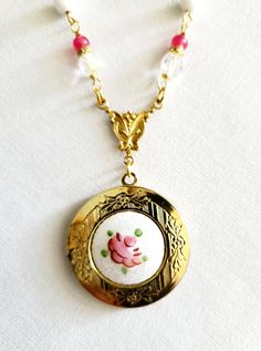 This necklace began with a vintage, guilloche locket. I've added an antique style bail and white glass beads. The necklace currently can be worn from 24-26 inches with the built in extender (pendant w/ bail is 2 inches tall). Other lengths are also available - glass beads will be added/taken away to adjust length. All lengths will have an additional 2 inches with the built in extender. Vintage Adjustable Locket Necklace, Vintage Charm Oval Locket Necklace Keepsake, Vintage Oval Pendant Necklace Keepsake, Vintage Brass Locket Necklace With Antique Finish, Vintage Charm Brass Locket Necklace, Bakelite Bracelets, Vintage Assemblage Necklace, Slide Bracelet, Vintage Assemblage