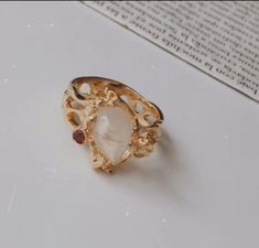 ALLE Fine Handcrafted Edgy Jewelry, Perfectection in Design Gold Moonstone Ring With Gemstone Accents As Gift, Unique Gold Moonstone Ring For Healing, Edgy Jewelry, Garnet Stone, 22k Gold, Stone Settings, In Design, Timeless Pieces, Handcrafted Jewelry