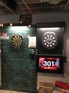 darts are on the wall next to darts