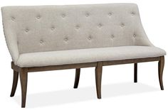 a white couch with buttons on the back and arm rests in front of a white background