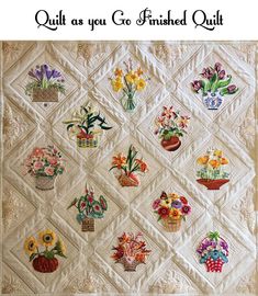 the quilt as you go finished quilt has many different flowers in each basket on it