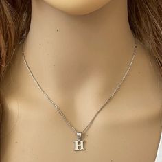 Description: 925 Sterling Silver Mini Small Initial Letter H Pendant Necklace Item No.: H89.Q Metal Type: 925 Sterling Silver (Available In 10k And 14k Gold) Metal Color: Silver Height With Bale: 15 Mm Width: 4.8 Mm Italian Rolo Chain In 16", 18", 20", Available In Another Listings In Any Letter A-Z H Pendant Letter, Silver Hypoallergenic Initial Pendant Jewelry, H Initial Necklace, Letter H Necklace, H Necklace, Couple Ring Design, Shark Tooth Pendant, Shine Jewelry, Cross Necklace Sideways