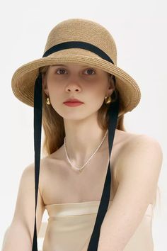 Timeless Elegance with Ribbon Tie This adjustable French straw cloche hat exudes timeless French chic. Made from premium straw, it features a wide brim and a long ribbon tie for added elegance. The internal adjustable band ensures a secure fit, making it ideal for both casual and formal summer occasions. Its foldable design allows for easy storage and portability. Elevate your style with this sophisticated yet practical hat. Style #: WWAJ552 Chic Straw Panama Hat With Curved Brim, Chic Straw Fedora For Kentucky Derby, Elegant Vacation Straw Hat Made Of Paper Straw, Elegant Paper Straw Hat For Vacation, Chic Straw Panama Hat With Wide Brim, Chic Straw Panama Hat With Short Brim, Elegant Fedora Straw Hat For Vacation, Elegant Brimmed Straw Sun Hat, Elegant Spring Panama Hat In Paper Straw