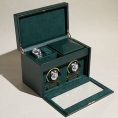 Wolf "British Racing" Green Faux Leather Two-Module Watch Winder. From Wolf, the "British Racing" green collection is a tribute to the illegal racing that took place in Ireland in the early 1900s. Made with vegan-friendly pebble-grained faux leather and sumptuous interior suede details. Take your watches for a spin in the double watch winder. Storage spot for two watches and accessories also included! Wolf winders come with a patented innovation that counts the precise number of rotations. Rotat Elegant Green Rectangular Watch, Elegant Green Rectangular Watches, Green Rectangular Watches For Formal Occasions, Elegant Green Watch As A Gift, Elegant Green Watch For Gift, Formal Green Watches With Diamond Hour Markers, Elegant Green Chronometer Watch, Elegant Green Watch Accessories With Subdials, Gadget Tecnologici