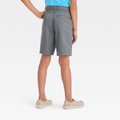 They'll be ready for warm-weather days in these Quick Dry Flat Front 'At the Knee' Chino Shorts from Cat & Jack™. The mid-rise chino shorts are crafted from soft, stretchy poplin fabric with lining and quick dry finish to offer them all-day cool comfort. They're designed with a flat front for a regular-fit silhouette and feature a fly snap with belt loops to help them find the best fit. In a solid hue, they can pair them with different tops for versatile wear options. Cat & Jack™: Kids’ clothing Mid Rise Jean Shorts, Boys Ties, Kids Clothes Boys, Mesh Shorts, Adjustable Waistband, Hem Style, Knit Shorts, Bottom Clothes, Pair Of Pants