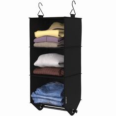 a black garment rack with clothes on it