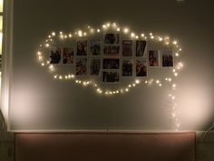 the wall is decorated with pictures and lights