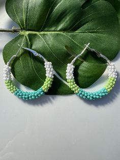 These green beaded hoop earrings are made with premium Czech glass seed beads. Earring Hoops: 35mm sliver plated (Nickel Free) for the sensitive skin. They're modern and pretty. They'll definitely add a fresh spring flair to you. This item is only 1 available. After purchased, I don't accept exchange. I do accept returns. About return this item, please refer to the store policy. All items of my store will be packed in a nice gift box(Ready to Gift). Please take a look at some of the other items in my shop: https://www.etsy.com/shop/HappyGemsandBeads If you have any question, please feel free to message me on Etsy. I'll be glad to answer your questions as soon as possible. Thank you for your support! Handmade Green Beaded Hoop Earrings, Green Bohemian Hoop Beaded Earrings, Bohemian Green Beaded Small Hoop Earrings, Bohemian Green Small Hoop Beaded Earrings, Bohemian Green Beaded Hoop Earrings, Green Hoop Beaded Earrings With Dangling Beads, Handmade Small Green Hoop Earrings, Hoop Beaded Earrings With Spacer Beads, Green Hoop Beaded Earrings