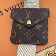 Authentic Louis Vuitton Utility Bag Strap And Monogram Pouch. Gorgeous Beige Strap, With Lv Signature Throughout. Honey Wheat Leather Tabs, Golden Hardware. Strap Length Is Approx: Longest: 45", Shortest: 25 1/2", Width: 1 5/8" New, Never Worn. Pouch Is Removable And Strap Is Adjustable. 2302v103073. Includes Box, Dust Bag. ** Please Note: Handbag Is Not Included. It Is Just To Show How Well This Straps Coordinates With The Damier Azur Pattern With Patina Vachetta Leather. Designer Wallet With Removable Pouch For Travel, Designer Travel Wallet Pouch, Designer Travel Wallets In Pouch Shape, Designer Travel Pouch Wallets, Luxury Wallet With Detachable Strap For Daily Use, Monogram Canvas Pouch With Removable Pouch For Everyday, Luxury Pouch With Detachable Strap, Luxury Travel Pouch With Detachable Strap, Designer Travel Pouch