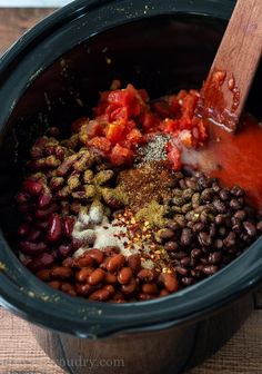 beans, spices and seasonings are mixed in the crock pot for this recipe