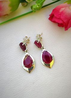 "Natural Ruby Earrings, Silver Stud Earrings, Natural Gemstones Jewelry, Dainty Stud Earrings, Natural Gemstone Studs, Gift for her Gemstone - Ruby ( Dyed ) Metal - German Silver Length - 1.35\" inch Width - 0.53\" inch Weight - 6.2 Grams" Pear-shaped Ruby Gemstone Earrings, Pear-shaped Ruby Earrings, Elegant Teardrop Stone Earrings, Formal Sterling Silver Earrings With Stones, Faceted Pear-shaped Earrings For Gift, Faceted Drop Earrings For Anniversary, Handmade Ruby Teardrop Earrings, Silver Drop Earrings With Stones, Sterling Silver Earrings With Stones