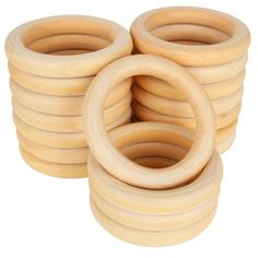 several wooden rings are stacked on top of each other in order to form the shape of an o - ring