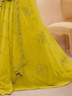 Introducing our adorable neon yellow sequins georgette wedding wear lehenga choli, a vibrant and stylish outfit that is perfect for any special occasion. This exquisite piece is made from high-quality georgette material in a stunning neon yellow color. It features intricate dori work, glitter sequin work, and embroidery work, adding a touch of elegance and glamour to the ensemble.
The set includes a matching georgette choli that is adorned with the same dori work, glitter sequin work, and embroi Yellow Embellished Dress For Navratri, Embellished Yellow Dress For Navratri, Pista Green Lehenga With Traditional Drape For Party, Yellow Organza Choli For Wedding, Yellow Floor-length Gown For Party, Floor-length Yellow Gown For Party, Party Wear Embellished Georgette Lehenga, Embellished Party Wear Lehenga In Georgette, Party Georgette Lehenga With Traditional Drape