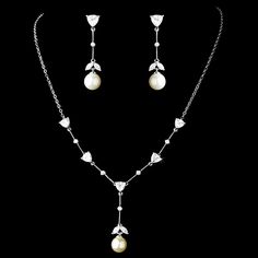 "This truly captivating Cubic Zirconia and pearl necklace will leave you breathless. It is delicate and refined and a beautiful set to wear after wedding for a special occasions or evening out. READY TO SHIP DETAILS: Necklace * Size: 15.5\" (Necklace Length) with 2\" (extender) & 1.5\" center drop Earrings * 1.5\" (Earring Length) * Offered in Silver COMPLETE COLLECTION: including Sashes, Hairpieces, Jewelry & Vintage Bags http://www.etsy.com/shop/AGoddessDivine?ref=si_shop A Goddess Divine Crea Elegant Pearl Bridal Sets With Pearl Drop, Silver Pearl Bridal Sets For Formal Occasions, Formal Silver Pearl Bridal Sets, Elegant Pearl Bridal Sets For Weddings, Elegant Pearl Drop Bridal Set For Wedding, Wedding Pearl Necklace In White Gold, Elegant Pearl Bridal Sets For Formal Occasion, Elegant White Bridal Sets With Pearl Drop, Wedding Necklaces With Pearl Chain And Diamond