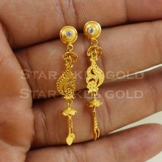 Elevate your style with these beautifully handcrafted gold earrings. Featuring a classic design and a comfortable fit, they add a refined touch to any look. Ideal for everyday wear or special occasions, they bring a subtle yet sophisticated sparkle. 18K Gold Dangle Earrings Metal is Real Gold Purity is 18kt Weight is 2.74 grams approx Max Length is 4.4 cm approx Max width is 0.7 cm approx ,  these earrings comes with normal backs, if you want real gold screw please contact. Please feel free to a Traditional 14k Gold Drop Earrings, Classic 22k Gold Earrings, Classic Gold Diamond Drop Earrings, Simple Design 14k Gold Earrings, Classic Gold Earrings With Elegant Design, 22k Gold Fine Jewelry Earrings For Formal Occasions, 22k Gold Earrings For Formal Occasions, 22k Gold Earrings For Formal Wear, Elegant Gold Earrings With Simple Design