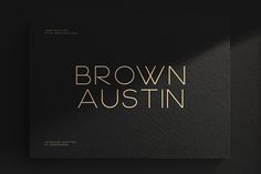 a black and gold brochure with the words brown austin on it