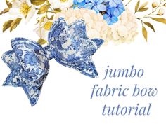 a blue and white bow with flowers in the background that says jumbo fabric box