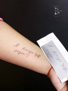 a woman's arm with the words i love you written on it