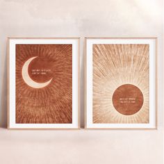 two framed art prints depicting the sun and moon in brown tones, one with a quote on it