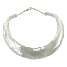 This elegant Italian artisan-designer studio collar choker necklace boasts a Lucite or resin rigid bib shape in translucent clear color complimented with silver flakes inclusions in an organic abstract free-form design. A silvered metal chain helps adjust the length. There is no visible maker's mark. Measurements: The inner circumference is 16.57 in (42 cm) - The front height is 1 in (2.6 cm) - The opening is 3.38 in (8.5 cm) - The necklace will fit an average 14.57 in circumference neck (37 cm) Organic Abstract, Vintage Choker Necklace, Collar Choker, Bib Collar, Vintage Choker, Transparent Resin, Designer Studio, Form Design, Choker Collar