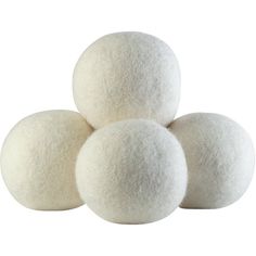 four white wool balls stacked on top of each other