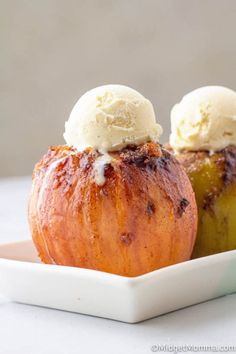 two desserts with ice cream on top sit in a white dish next to each other