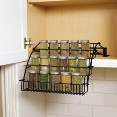 a spice rack in the corner of a kitchen