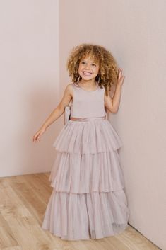 A chic take on a timeless style, our Breely Flower Girl dress is the perfect addition to your wedding line-up! Breely features a modest satin top with a three-tiered tulle skirt creating the perfect dress for your little one to twirl the night away! Breely is finished off with a low v-back and an oversized satin bow. M Tiered Princess Dress For Wedding, Confirmation Tulle Princess Dress With Ruffles, Tulle Princess Dress With Ruffles For Confirmation, Confirmation Princess Dress With Tulle Ruffles, Tiered Tulle Skirt Dresses For Dress-up, Bridesmaid Tiered Tulle Dress, Tiered Tulle Tutu Dress For Dress-up, Tiered Tulle Tutu Dress, Elegant Tiered Tulle Tutu Dress