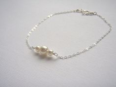 Sterling Silver Bracelet- Pearl Bracelet- White Pearl- Dainty Silver Bracelet- Tiny Pearl Jewelry- 925 Sterling Bracelet. $13.00, via Etsy. White Gold Charm Bracelet For Wedding, Sterling Silver Round Charm Bracelet For Wedding, Classic Sterling Silver Charm Bracelet For Wedding, White Sterling Silver Charm Bracelet For Wedding, Dainty White Gold Sterling Silver Bracelet For Wedding, Dainty Sterling Silver Bracelet For Anniversary, Dainty Hypoallergenic Charm Bracelet For Weddings, Adjustable Sterling Silver White Bracelet For Weddings, Adjustable White Sterling Silver Wedding Bracelet