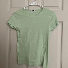 Brand New Never Worn Cotton On Light Green Short Sleeve Shirt. Size Small. Color Light Green. Basic Crew Neck Shirt For Spring, Spring Fitted Basic Shirt, Basic Fitted Shirt For Spring, Fitted Basic Shirt For Spring, Basic Stretch Shirt For Spring, Green Plain Tops For Spring, Plain Green T-shirt For Spring, Green Short Sleeve Shirt, Tan Shirt