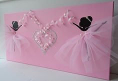 two ballerinas with pink tutus and tiaras are on a pink canvas