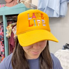 Dive into lakeside vibes with our Lake Life Foam Trucker Hat Snapback! This trendy hat, featuring 'LAKE LIFE' in a colorful font on either an orange or white foam hat, blends style with comfort. Crafted for those seeking a chic lakeside accessory, it's a must-have for retailers catering to customers who love the relaxed energy of lakeside living. Orange Trucker Hat, Funny Gifts For Women, Lakeside Living, Trendy Hat, Clothing Gifts, Mesh Netting, Hats Snapback, Tan Skin, Lake Life