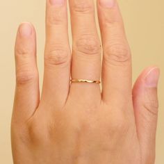 Meet the perfect everyday ring - the Dainty Stacking Ring. You'll fall in love the minute you put it on! Crafted in 14k solid gold, so you'll never have to worry about taking it off. It’s lightweight and dainty, so it’s perfect for everyday wear and is sure to give you a confidence boost as you take on your day. Make it yours and treasure your new favorite ring forever! DETAILS 14k solid gold ring 1.2mm band Available in sizes 5-8 Weights: 0.63g, 0.66g, 0.68g, 0.7g Safe for sensitive skin & show Printable Ring Sizer, Types Of Gold, Everyday Ring, Solid Gold Ring, Everyday Rings, Solid Gold Rings, Confidence Boost, Favorite Rings, Pure Gold