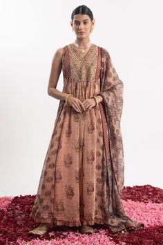 Peach anarkali with golden beads embroidered bodice, elevated with floral prints. Paired with a churidar and dupatta with floral prints - Aza Fashions Sleeveless Chanderi Anarkali Dress, Anarkali Sleeveless Georgette Kurta, Sleeveless Anarkali Georgette Kurta, Unstitched Sleeveless Salwar Kameez With Sheer Dupatta, Sleeveless Anarkali Set With Dabka Work For Wedding, Designer Anarkali Traditional Wear, Designer Sleeveless Anarkali Dress, Traditional Sleeveless Dress With Dupatta, Anarkali Sleeveless Dress With Dabka Work