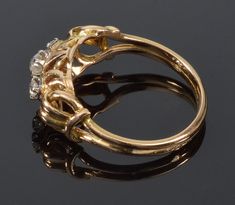 "Presented is a beautiful 19th century French 18K yellow gold ring with 3 sparkling old mine cut diamonds. Size of the ring is 6 - 6 ¼. The face of the ring is 11/16\" X 5/16\". It raised approx. 1/4\" off the finger. The central diamond is 3.6 mm which is approx. 0.26 carats. 2 side diamonds are 2.5 mm across, approx. 0.09 carats each. The ring is stamped with eagle head, which is a French hallmark for 18K gold. The ring weighs 3.1 grams. Excellent antique condition. The old jewelry box is show Victorian Yellow Gold Diamond Cluster Ring, Victorian Yellow Gold Cluster Ring With Diamond Accents, Victorian Cluster Ring With Diamond Accents In Yellow Gold, Victorian Gold Three-stone Ring, Victorian Gold Three Stone Ring, Victorian Gold Diamond Ring With Accents, Gold Victorian Diamond Ring, Old Jewelry Box, Eagle Head