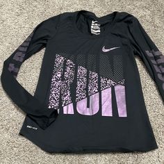 Black Long Sleeve With Purple Metallic Print. Never Worn Nike Purple Fitted Top, Fitted Nike Purple Tops, Tops Nike, Purple Metallic, Metallic Prints, Nike Black, Nike Tops, Nike Dri Fit, Black Long Sleeve