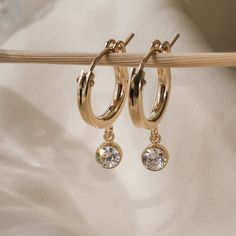 Everyday Dangle Hoop Earrings, Everyday Dangle Hoop Earrings For Pierced Ears, Minimalist Crystal Earrings For Everyday, Hypoallergenic Dangle Hoop Earrings, Gold Small Hoop Crystal Earrings, Tarnish Resistant Hoop Earrings For Everyday, Adjustable Single Crystal Earring For Everyday, Everyday Hoop Earrings With Lever Back Ear Wires, Everyday Dangle Crystal Earrings