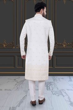 Embody classic elegance with our Mens Sherwani- U2-S379. Featuring delicate thread embroidery adorned with shimmering sequins, this Groom's sherwani exudes sophistication and luxury. Perfect for weddings and special occasions. Elevate your style and make a lasting impression. Festive Long Sleeve Sherwani For Reception, Long Sleeve Kurta With Naqshi For Reception, Formal Chikankari Embroidery Straight Kurta Bandhgala, Bandhgala With Naqshi For Reception, Formal Bollywood Nehru Jacket With Chikankari Embroidery, Formal Sherwani With Chikankari Embroidery For Diwali, Ceremonial Elegant Semi-stitched Sherwani, Elegant Ceremonial Churidar With Resham Embroidery, Elegant Churidar With Resham Embroidery For Ceremonial Occasions