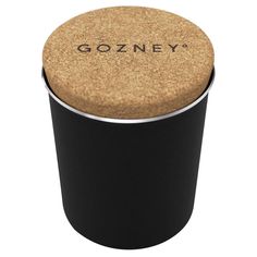 a black canister with cork lid and the word gonzoy written on it