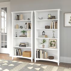 a white bookshelf filled with lots of books