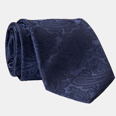 I believe in choosing pieces that stand out, which is why I love this intricate woven jacquard paisley tie in midnight blue. It’s a perfect choice for formal occasions, evening wear, or adding a touch of sophistication to your business attire. Handmade from luxurious thick silk, this tie offers a timeless elegance that’s anything but ordinary. Why settle for the usual when you can have something extraordinary? Details Standard Length: Approx. 3.25" x 58.5" (8 x 149cm). A classic tie width and le Elegant Blue Tie For Business, Blue Elegant Suit And Tie Accessories For Formal Occasions, Elegant Business Suit And Tie Accessories With Paisley Print, Elegant Blue Ties, Blue Paisley Print Suit And Tie Accessories, Luxury Blue Silk Ties, Timeless Blue Suit And Tie Accessories For Formal Occasions, Luxury Blue Suit And Tie Accessories For Semi-formal Occasions, Elegant Black Tie Suit Accessories With Paisley Print