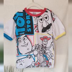 This Playful T-Shirt Features A Colorful Design Perfect For Any Young Toy Story Fan. The Shirt Is White With Contrasting Red, Blue And Yellow Trim For Added Style. The Front Graphic Showcases Beloved Characters Buzz Lightyear, Mr. Potato Head, Woody, And Rex In A Fun And Dynamic Layout. Made From Comfortable And Durable Materials. Size: 5/6 Color: White (Red, Blue, Yellow Accents) Material: 79% Polyester, 30% Cotton Care: Machine Wash Approx Measurements: Shoulder To Shoulder 14", Armpit To Armp Playful Cartoon Print T-shirt For Playwear, Multicolor Cartoon Print T-shirt For Playtime, Character Print Crew Neck T-shirt For Playtime, Multicolor Disney T-shirt For Summer, Crew Neck T-shirt With Character Print For Playtime, Character Crew Neck Cotton Top, Cotton Character Print Tops, Themed Multicolor T-shirt With Character Print, Fun Character Print T-shirt For Playtime