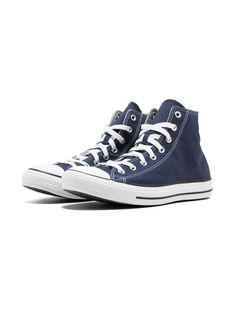 "Find CONVERSE Chuck Taylor All Star Hi \"navy\" Sneakers on Editorialist. Navy blue canvas All Star Hi top sneakers from Converse featuring a round toe, a lace-up front fastening, a flat rubber sole and side logo patch. These styles are supplied by a premium sneaker marketplace. Stocking only the most sought-after footwear, they source and curate some of the most hard to find sneakers from around the world." Navy Lace-up High-top Sneakers For Streetwear, Blue Converse Cotton High-top Sneakers, Blue Cotton Converse High-top Sneakers, Blue Casual Cotton High-top Sneakers, Sporty Navy Cotton Sneakers, Casual Navy High-top Sneakers With Rubber Sole, Blue Lace-up High-top Sneakers With Elastic Laces, Casual Converse Sneakers With Elastic Laces, Converse Canvas Shoes With Laces