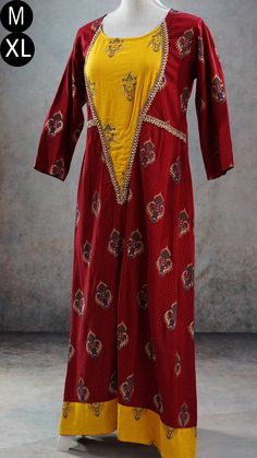 **Product color may have slight variations due to surrounding light** PRODUCT DETAILS This is a very beautiful maroon and yellow ethnic dress with gold print and Indian print throughout its body. It has gota patti detailing near its yoke and sleeves. It has three-quarter sleeves, and asymmetric hem. The Kurti has a slightly wider neck. It can be worn with a leggings or as a dress. Size & Fit Medium Chest: 38 inches Waist: 36 inches Back Shoulder: 15 inches Sleeve Length: 17 inches Armhole Round: Red Printed Lawn Suit For Wedding, Wedding Lawn Suit In Red With Printed Details, Traditional Dresses With Printed Motifs, Festive Cotton Dress With Traditional Drape, Long Cotton Dresses For Eid, Festival Anarkali Set With Printed Details, Festival Anarkali Set With Prints, Festive Traditional Drape Cotton Dress, Fitted Cotton Silk Anarkali Set With Printed Motifs