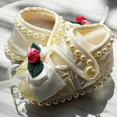 Handmade With High-Quality Satin Elegant Pearl Trim And Floral Embroidery Soft And Comfortable For Infants Ideal For Special Occasions Beautiful Baby Shower Gift Pattern Or Texture: Satin With Lace And Pearl Accents Season Or Weather: All Seasons Care: Hand Wash Recommended, Lay Flat To Dry Made In: Usa Measurements: Sole Length: 3.5 Inches / 9 Cm Width: 2 Inches / 5 Cm Height: 3 Inches / 7.5 Cm Features: Satin Finish With Pearl Trim Rose Accents With Ribbon Bows Suitable For 0-6 Months Soft And Cute Booties For Baptism, Cute Round Toe Booties For Baptism, Baptism Booties With Soft Sole And Round Toe, Cute White Booties For Baptism, Platform Tennis Shoes, Girls Ballet Flats, Leopard Print Booties, Kids Rain Boots, White Casual Shoes